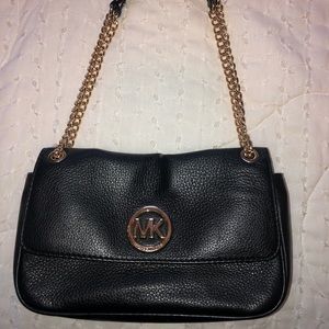 Leather Michael kors bag with adjustable gold chain strap.